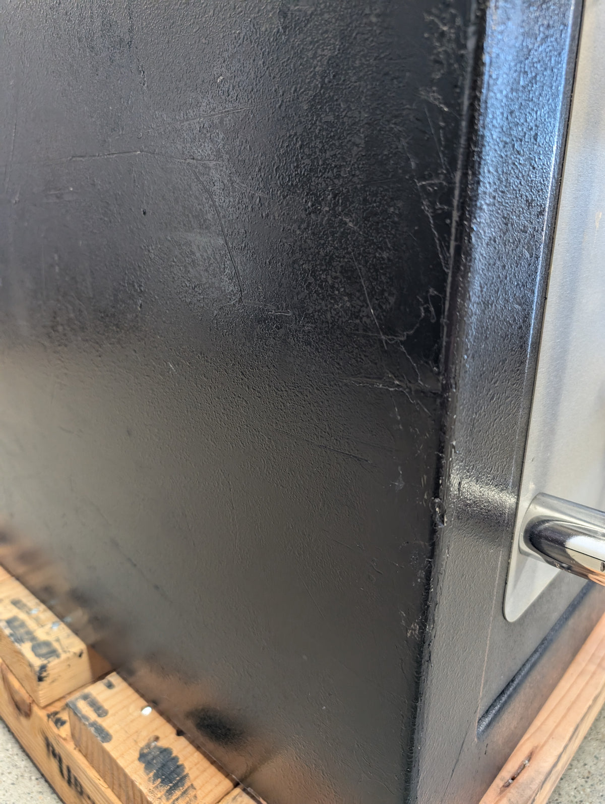 Blemished American Security CEV1814 photo of scuffs and scrapes on left side of safe with factory touch up paint applied. 