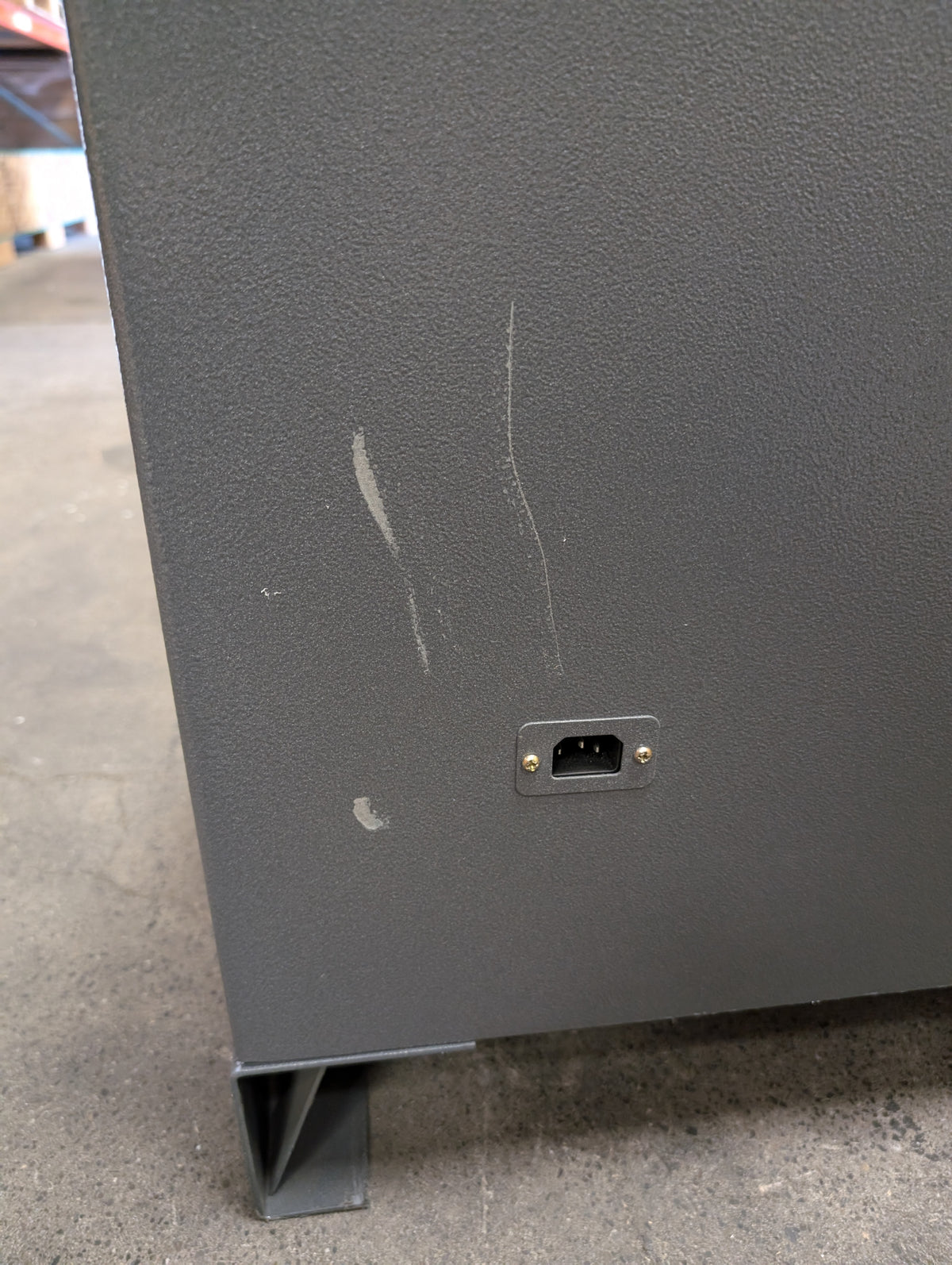 Blemished AMSEC NF6032E5 scratches near AC outlet on back side of safe