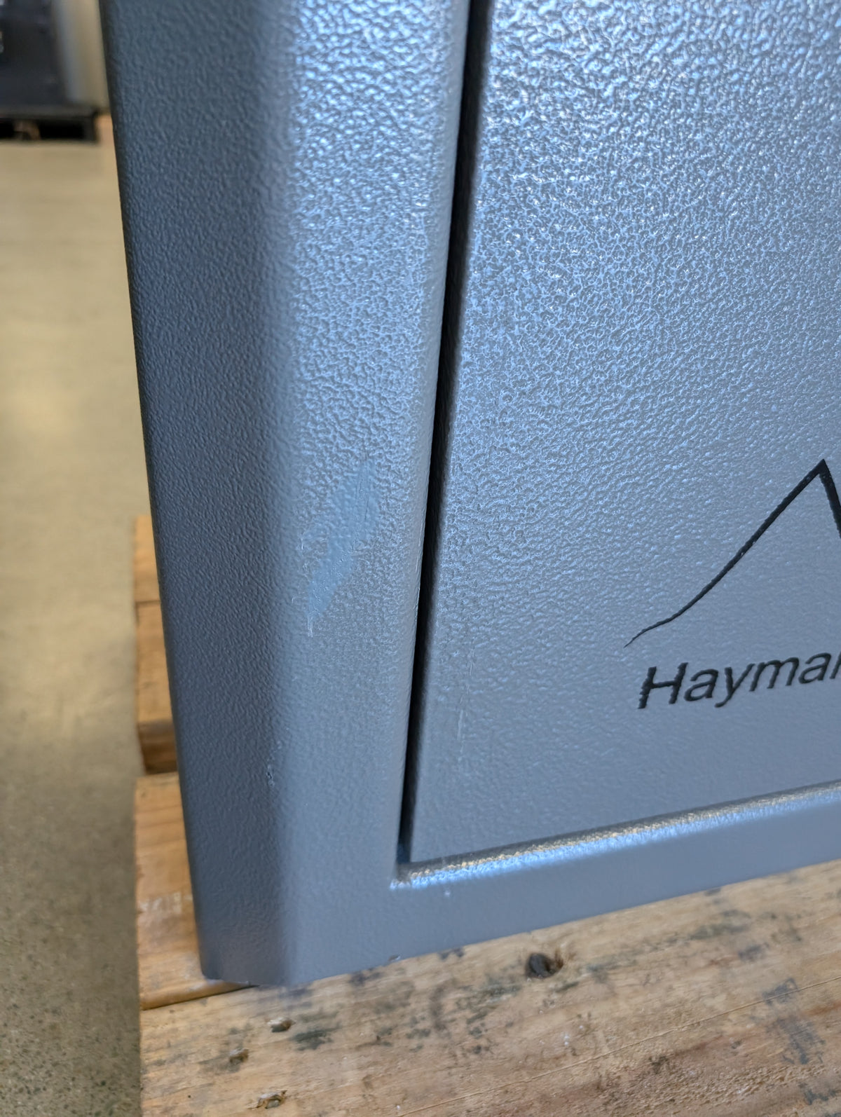 Blemished Hayman RK-5922 blemish on front left edge of safe near bottom with touch up paint applied. 