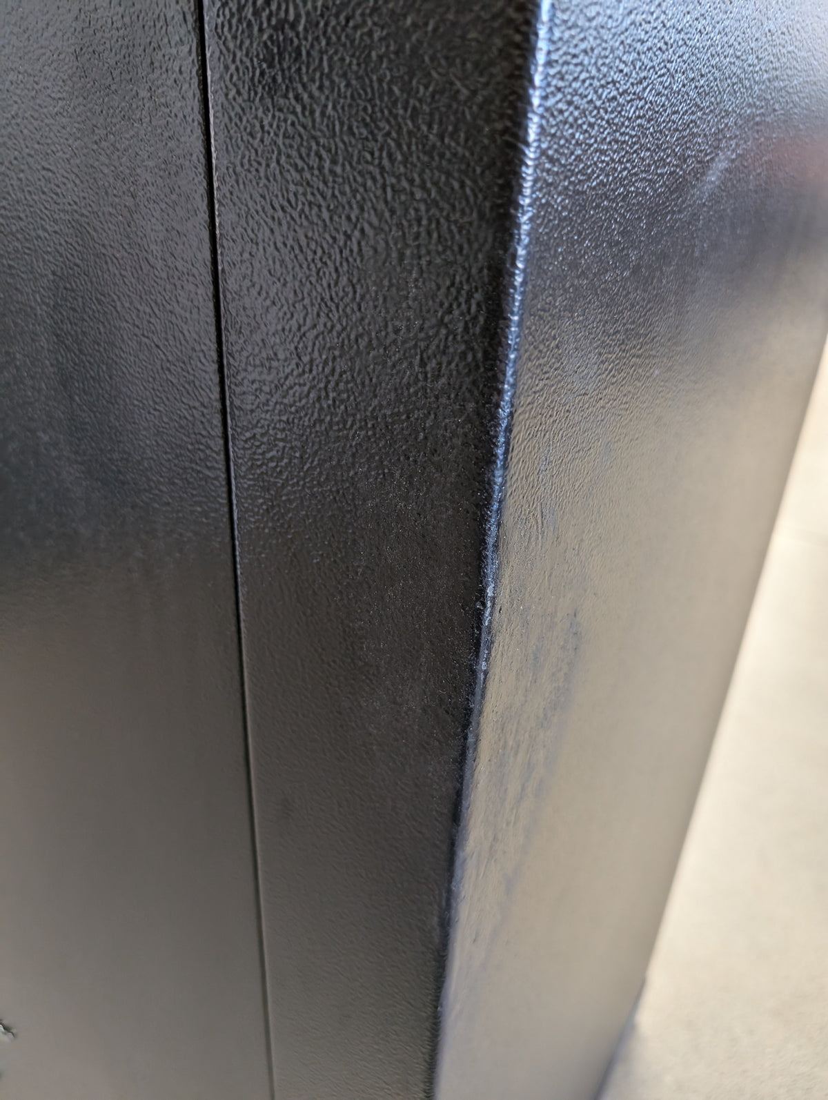 Blemished American Security SF6036E5 view of larger blemish on front right edge of safe with touch up paint applied. 